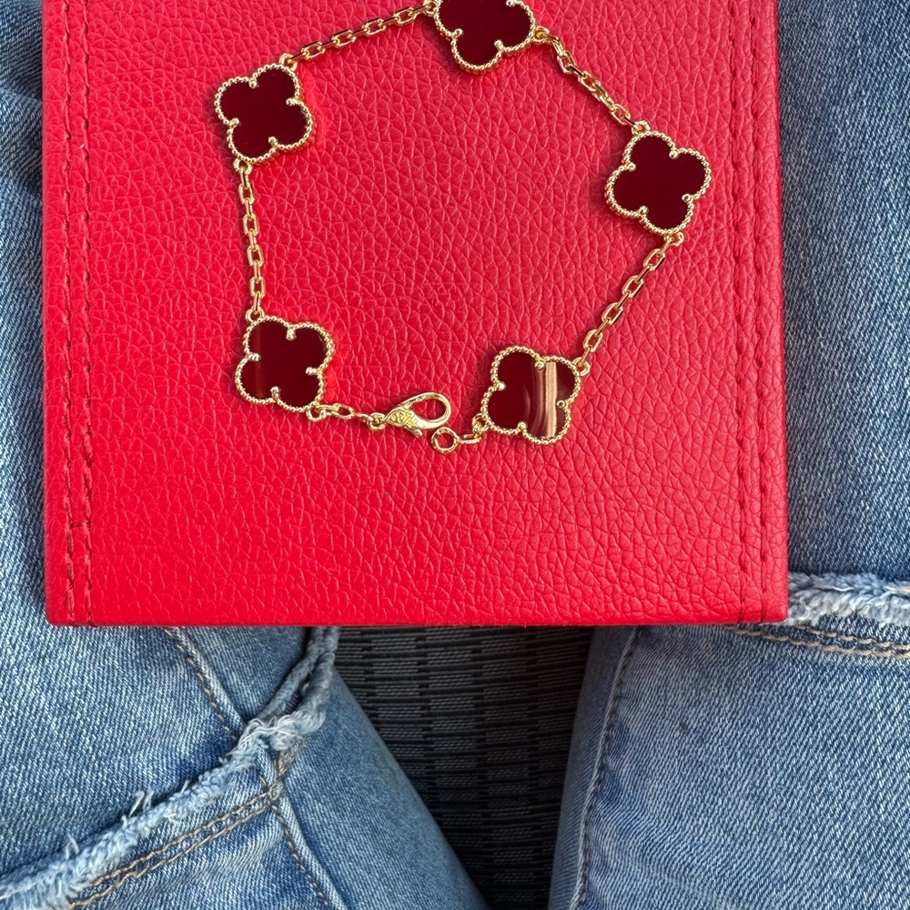 Elegant Gold and Red Clover Bracelet
